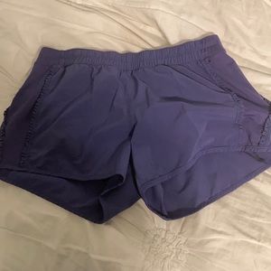 Purple lululemon shorts with ruffle down the sides